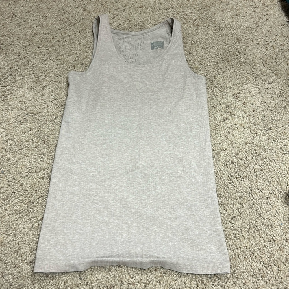 This is an athleta tank top, size M, and it is a light brown/ tan color